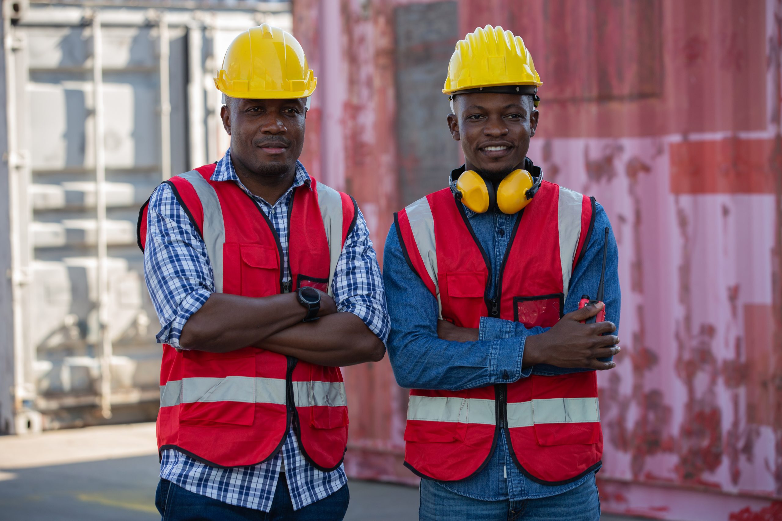 Foreman or worker work at Container cargo site check up goods in Foreman or worker work at Container cargo site check up goods in container. Foreman or worker checking on shipping containers. Logistics and shipping